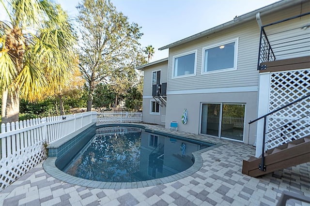 view of swimming pool with a patio area