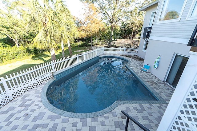 view of pool featuring a patio