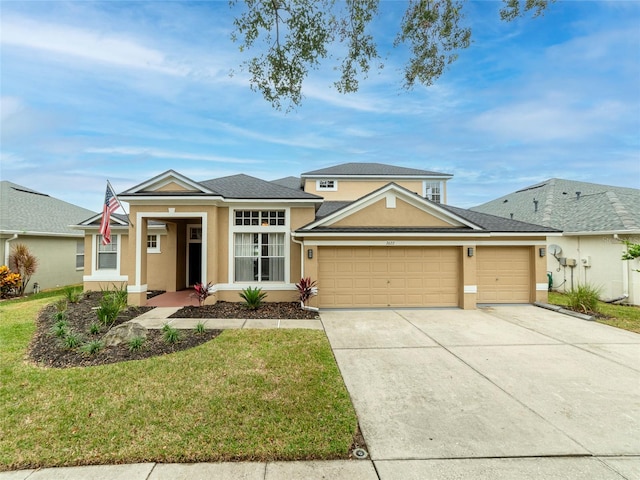 view of front facade with a garage and a front yard