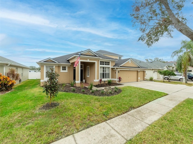 ranch-style house featuring a garage and a front yard