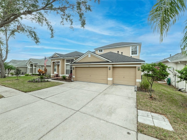 view of front of property with a garage and a front yard