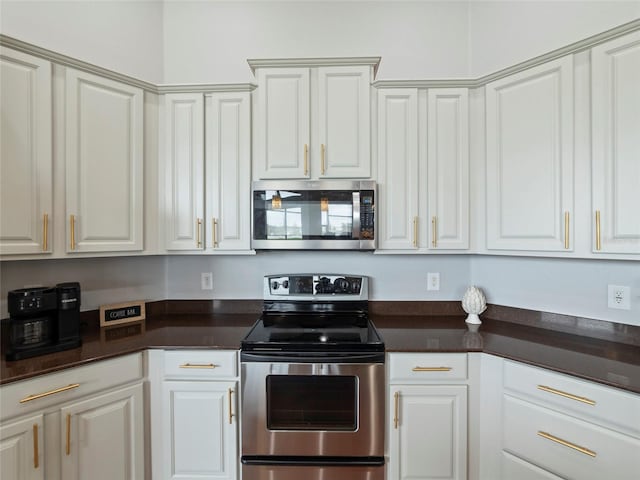 kitchen with white cabinetry and appliances with stainless steel finishes