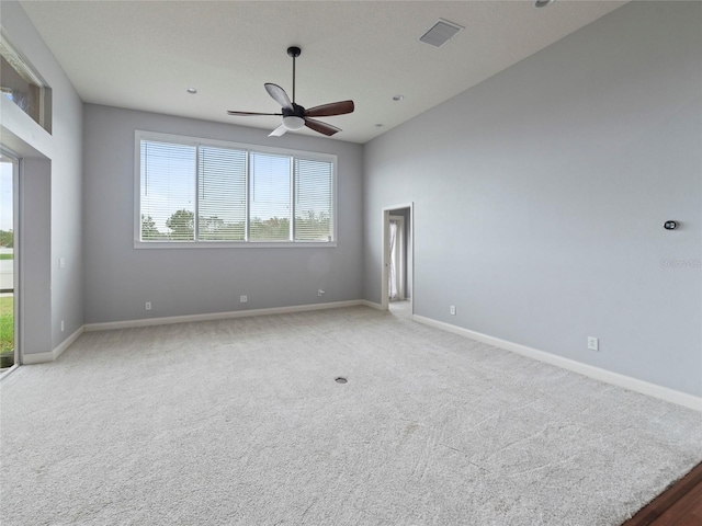 spare room with light carpet and ceiling fan