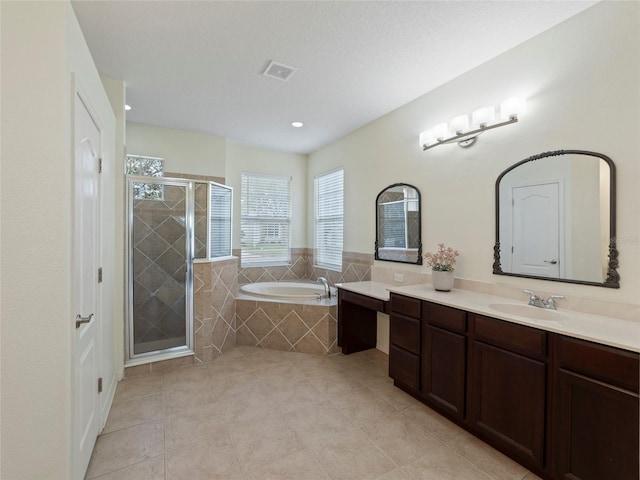 bathroom featuring vanity, tile patterned floors, and independent shower and bath