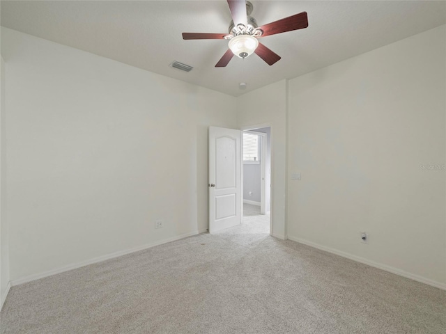 empty room with light carpet and ceiling fan