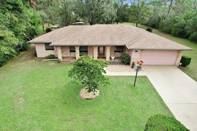 ranch-style house with a garage and a front yard