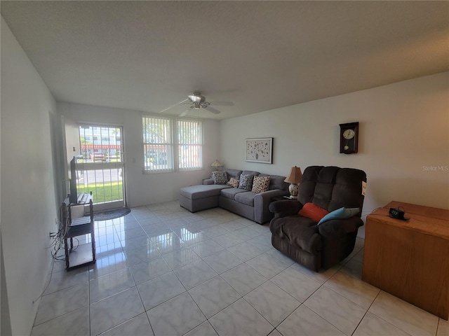 tiled living room featuring ceiling fan