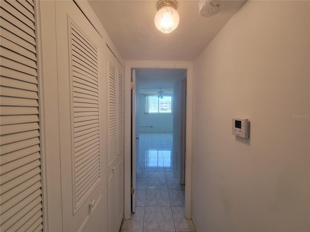 hallway featuring light tile patterned flooring