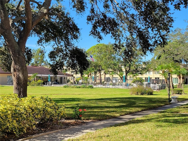 view of property's community featuring a yard