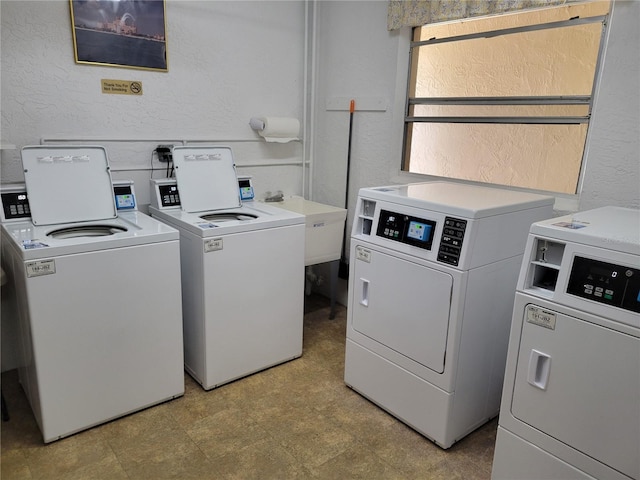 washroom with washing machine and dryer