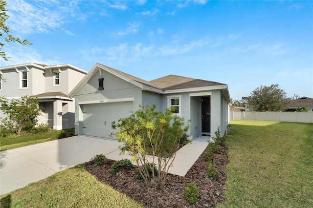 view of front of house featuring a garage and a front lawn