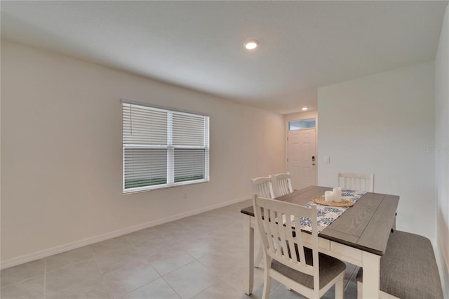 dining area featuring light tile patterned floors