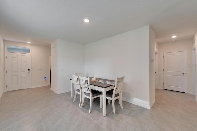 dining space with light tile patterned flooring