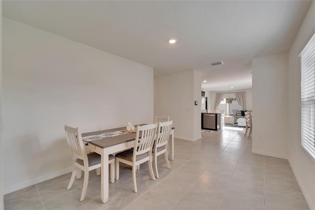 dining area featuring light tile patterned flooring