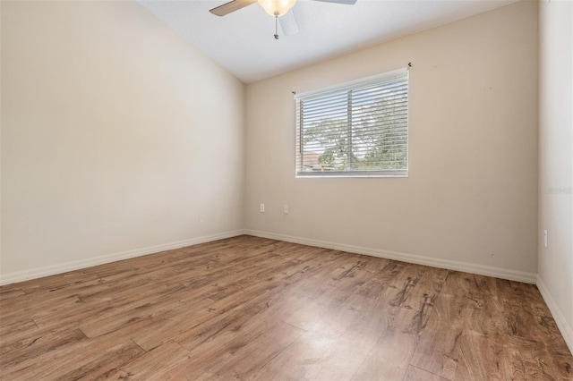 unfurnished room with ceiling fan, lofted ceiling, and light hardwood / wood-style floors