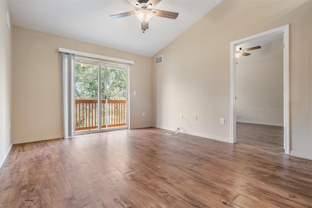 spare room with hardwood / wood-style floors, ceiling fan, and lofted ceiling