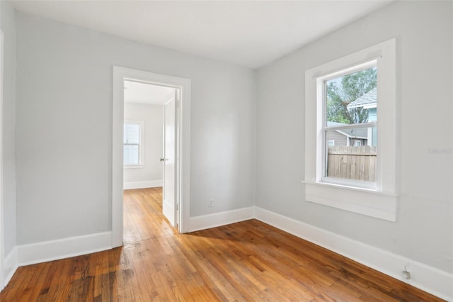 empty room with wood-type flooring