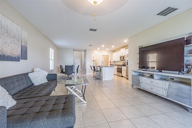 living room featuring light tile patterned flooring