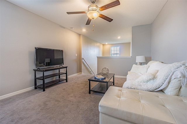 carpeted living room featuring ceiling fan