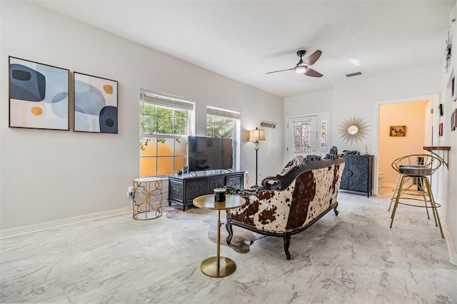 living room with ceiling fan