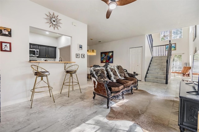 living room with ceiling fan