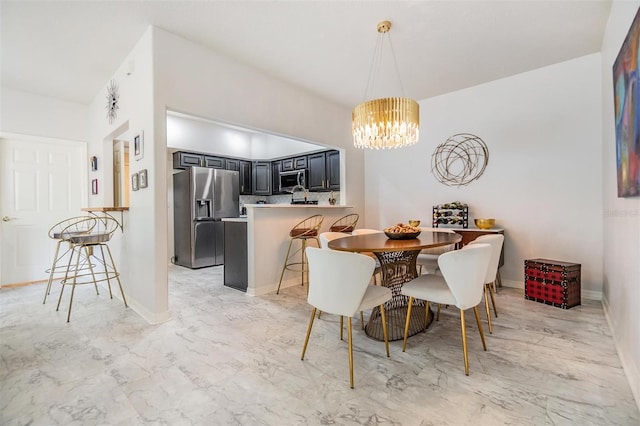 dining space with a chandelier