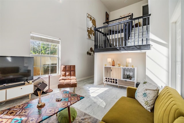 living room with a high ceiling