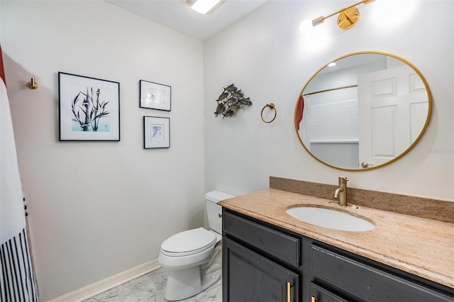 bathroom featuring a shower, vanity, and toilet