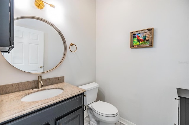 bathroom with toilet and vanity