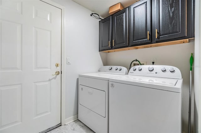 laundry area featuring cabinets and washer and dryer