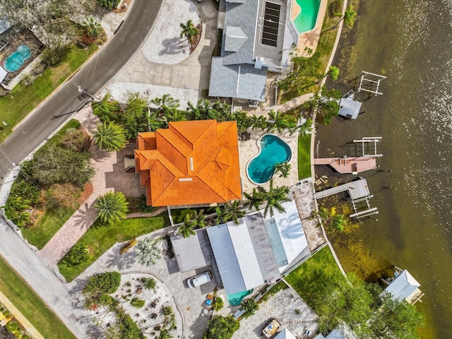 birds eye view of property featuring a water view