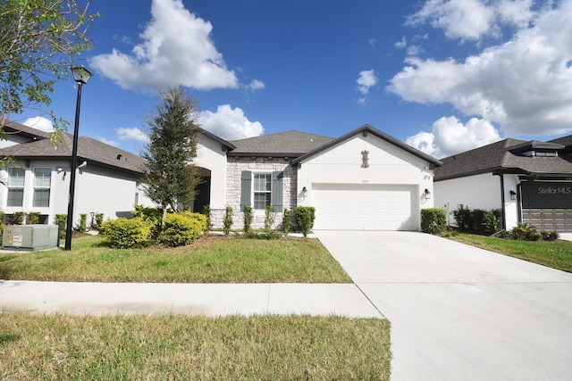 view of front of property featuring a garage and a front lawn