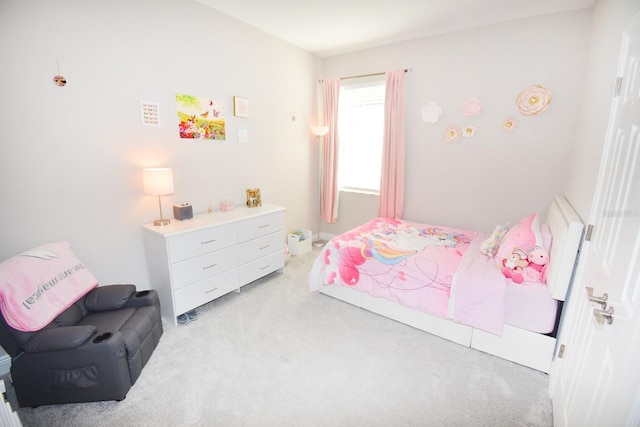 bedroom with light colored carpet