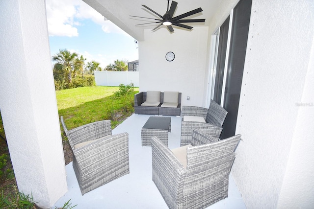 view of patio / terrace with ceiling fan and an outdoor hangout area