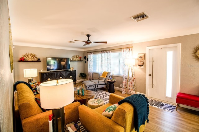 130 63rd St S, Saint Petersburg, FL 33707 - living area with wood finished floors, a ceiling fan, and baseboards
