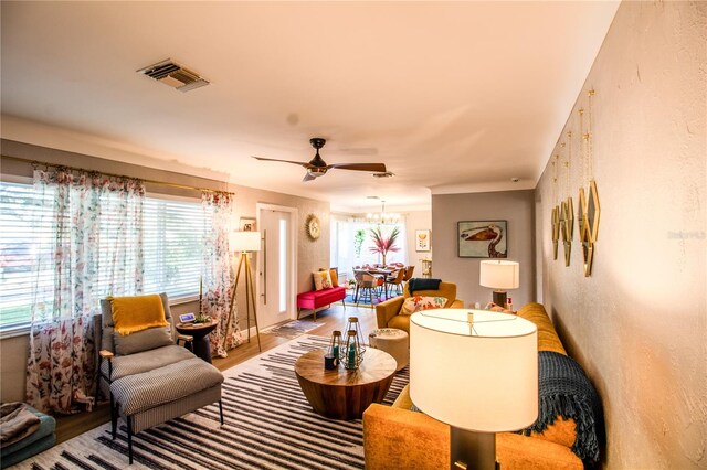 living room featuring ceiling fan and wood-type flooring