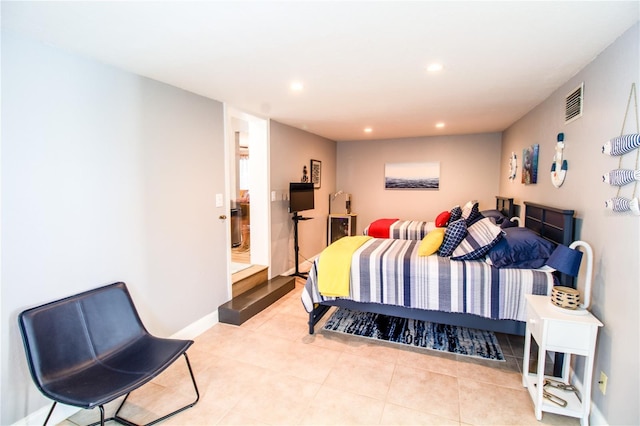 130 63rd St S, Saint Petersburg, FL 33707 - bedroom with recessed lighting, light tile patterned floors, and baseboards