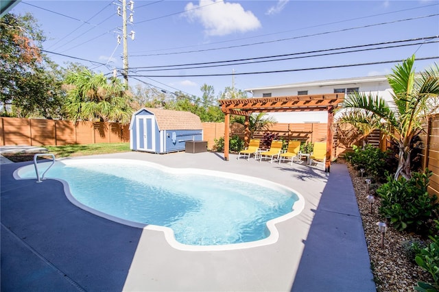 view of swimming pool featuring a storage shed, a pergola, and a patio area