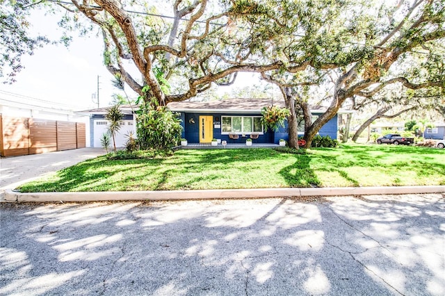130 63rd St S, Saint Petersburg, FL 33707 - single story home with driveway, a garage, and covered porch