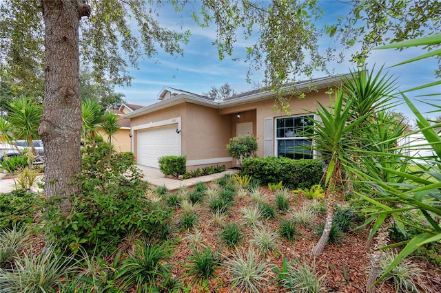 single story home featuring a garage