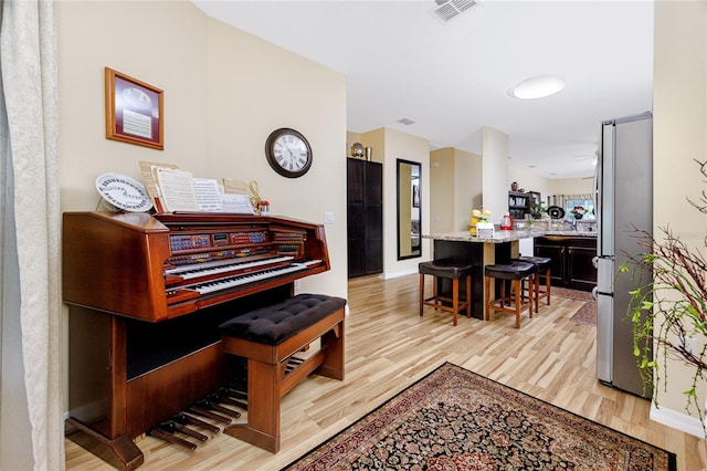 misc room with light hardwood / wood-style flooring