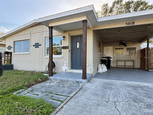 property entrance with a carport