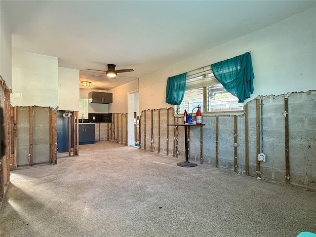 unfurnished living room featuring ceiling fan