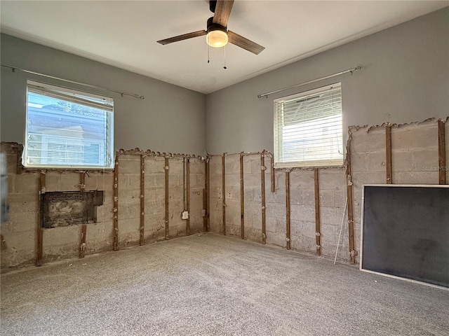 carpeted empty room with ceiling fan