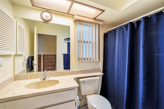 bathroom with vanity and toilet