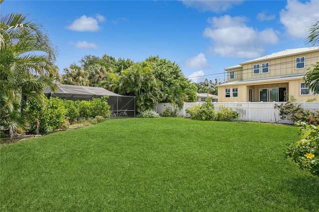 view of yard with a lanai