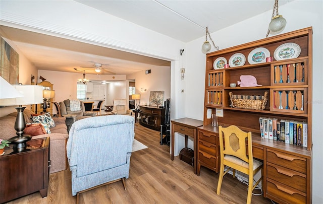 living room with hardwood / wood-style floors and ceiling fan