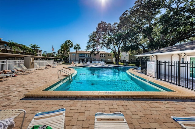 view of swimming pool with a patio area