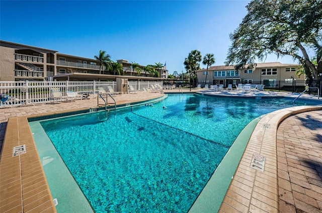 view of swimming pool featuring a patio area