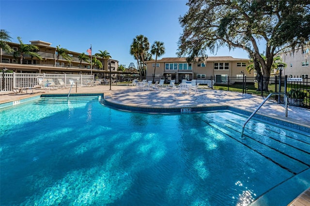 view of swimming pool with a patio area